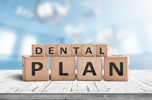 Wooden blocks spelling “Dental Plan”