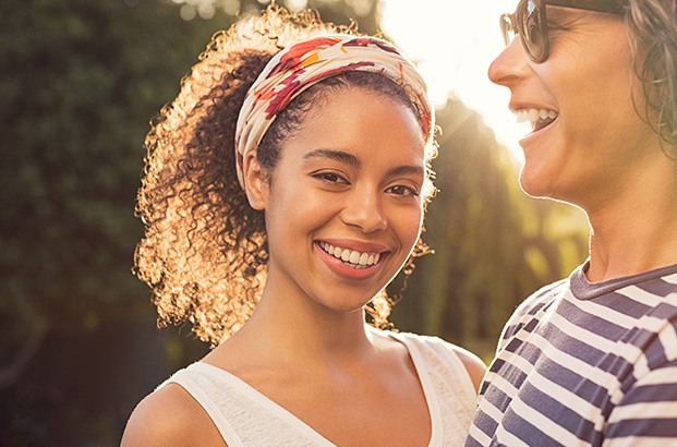 Woman smiling after completing cosmetic treatment
