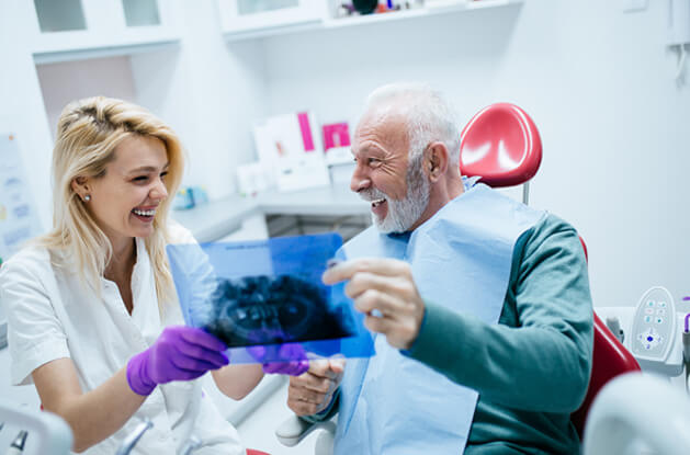 senior talking to a dentist