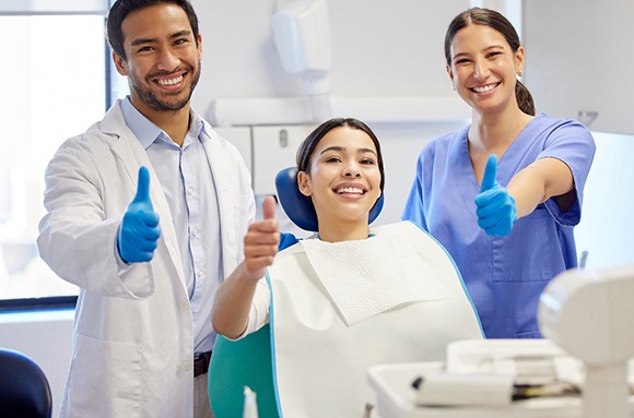 Patient looking at dental insurance form on phone outside