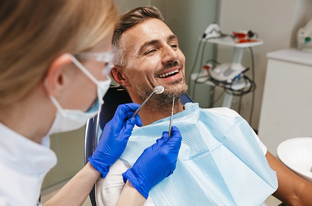  Man in dental chair about to undergo exam