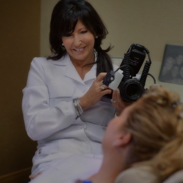 Dentist holding dental camera