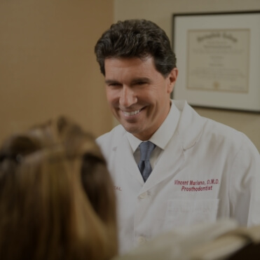 Dentist smiling at patient