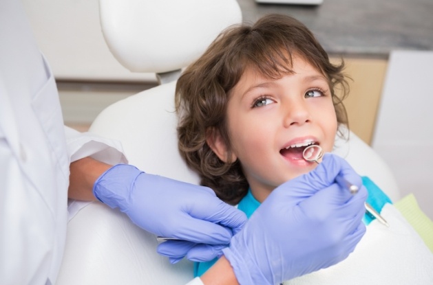 Child smiling at dental checkup