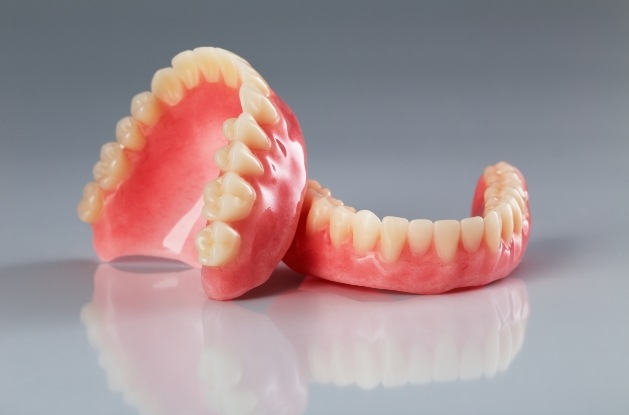 Two full dentures resting on tray
